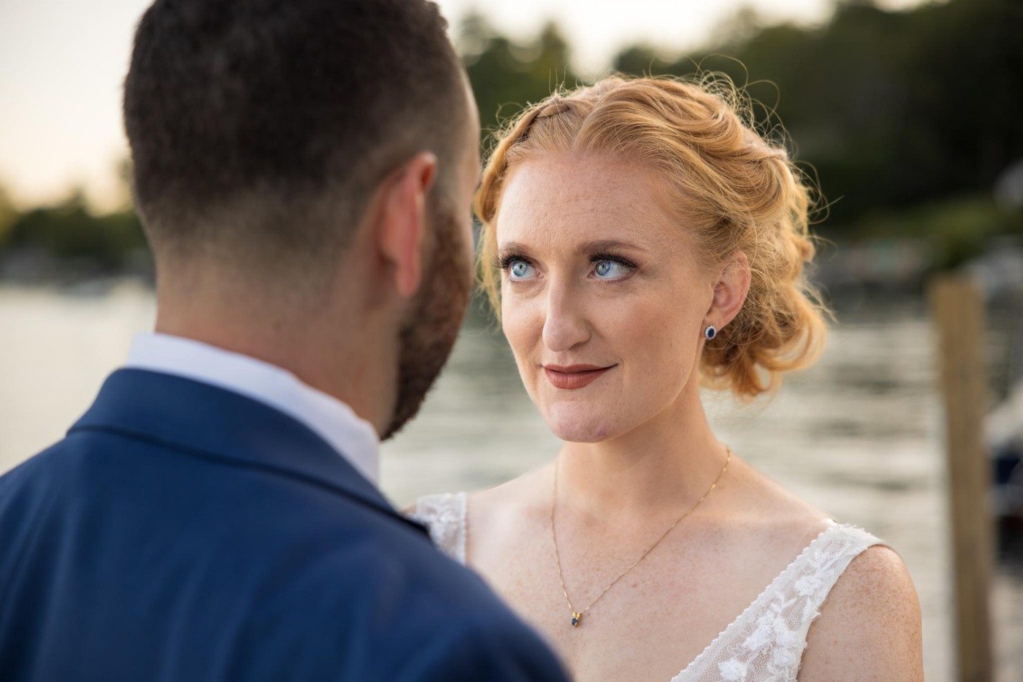 A bride looking intensely at her groom.
