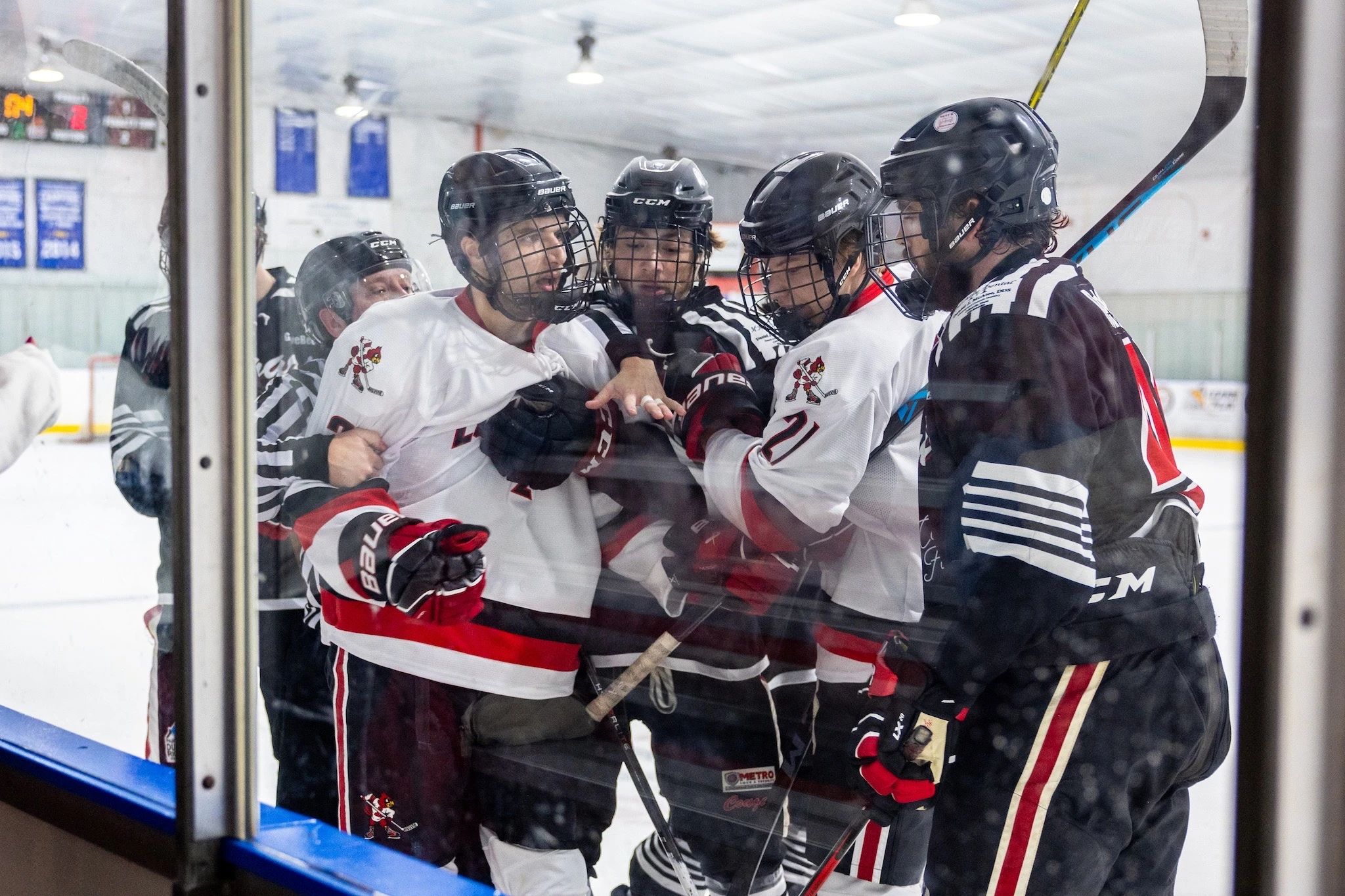 Players on the Louisville Cardinals and Southern Illinois-Edwardsville having a scuffle.