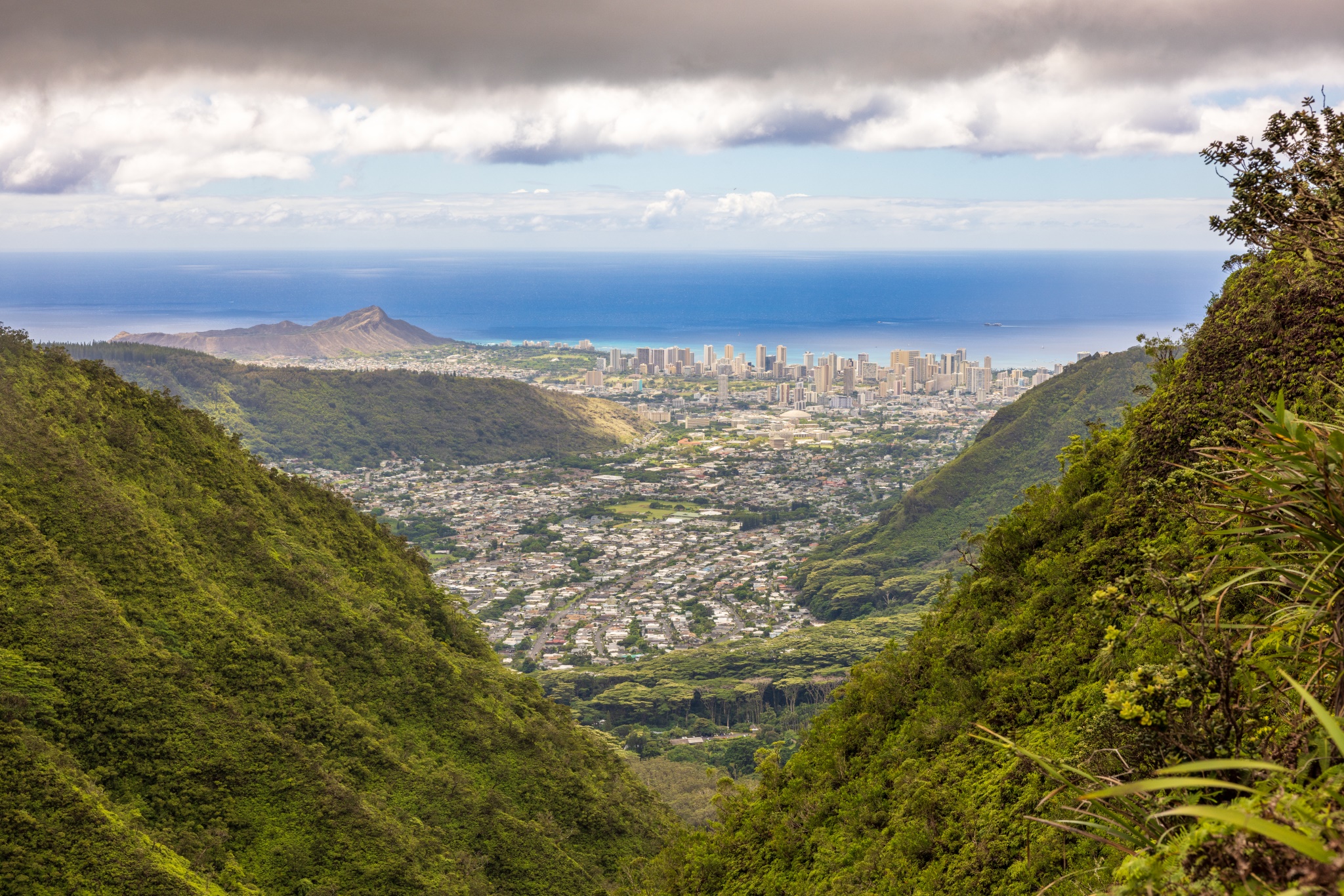 Hawaiian mountains with the buildings of Honolulu in the distance.