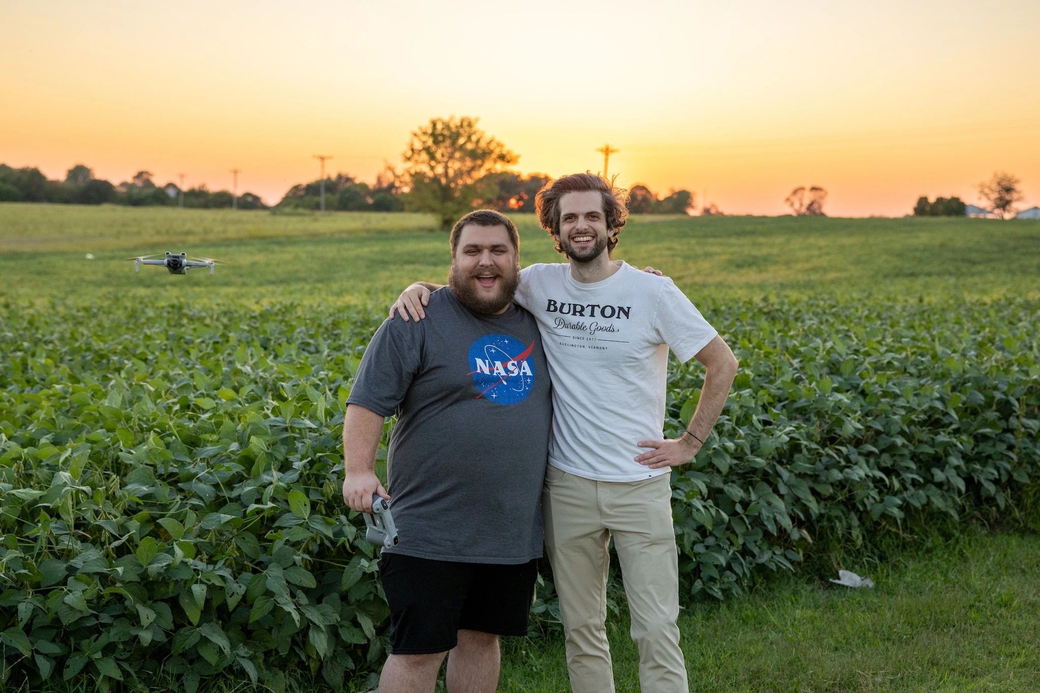 Taylor, Zach, and Taylor's drone at sunset.