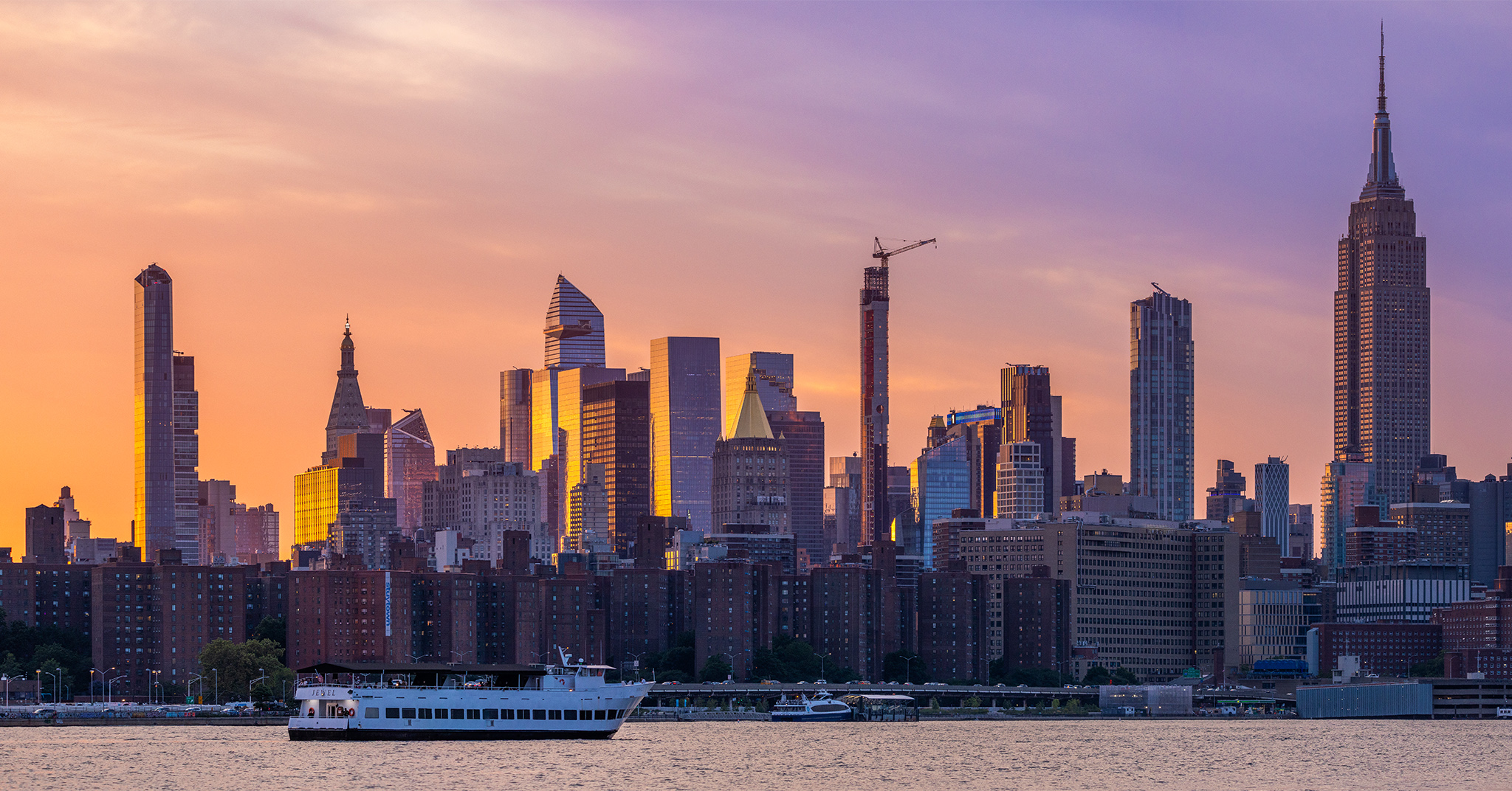 A panorama of Midtown Manhattan at sunset.